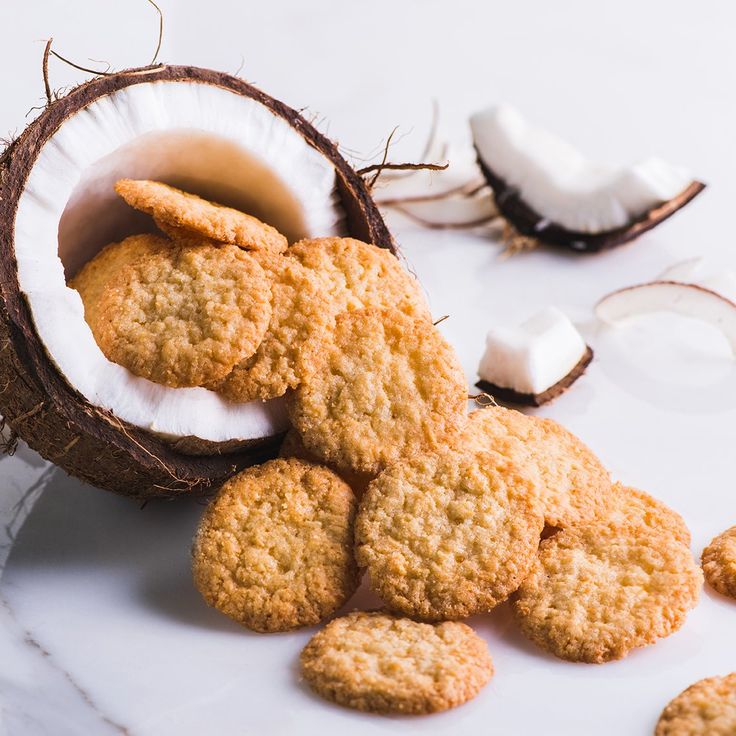 coconuts and cookies on a white table