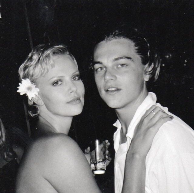 black and white photograph of a man and woman posing for the camera at an event