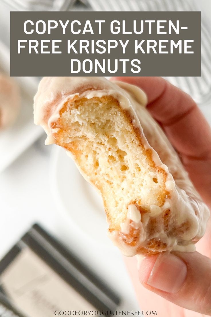 a person holding up a half eaten doughnut with glaze on it and the text overlay reads copycat gluten - free krispy krem donuts