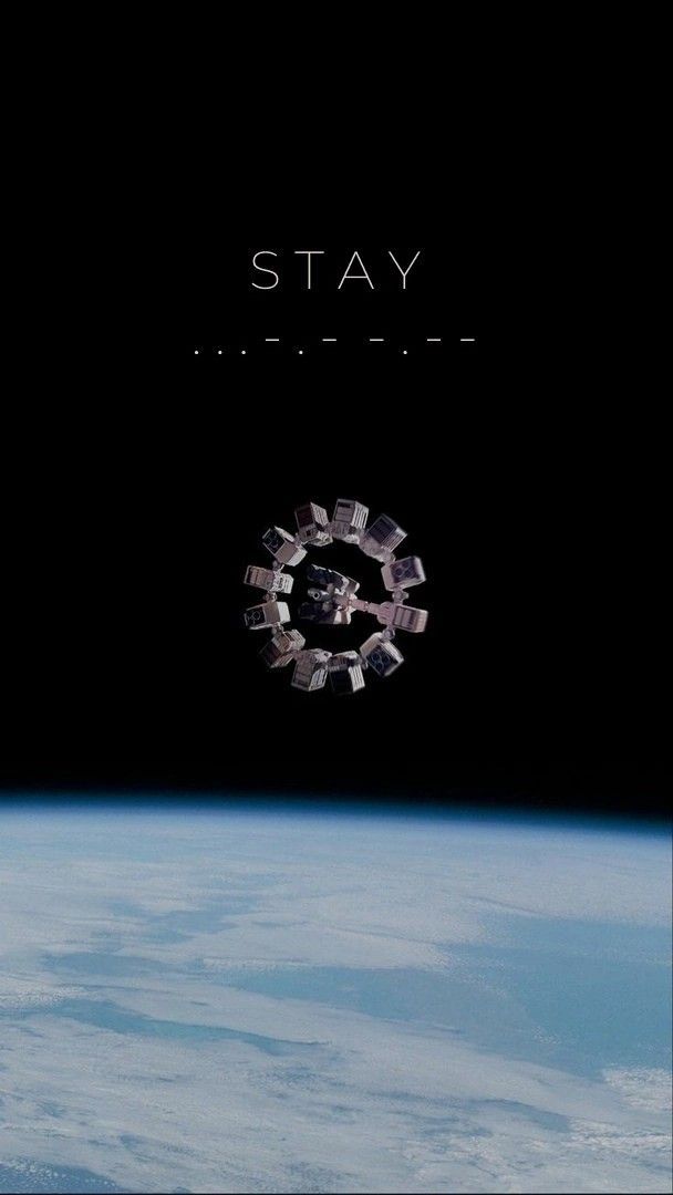 the cover art for stay album, with an image of a space station in the background