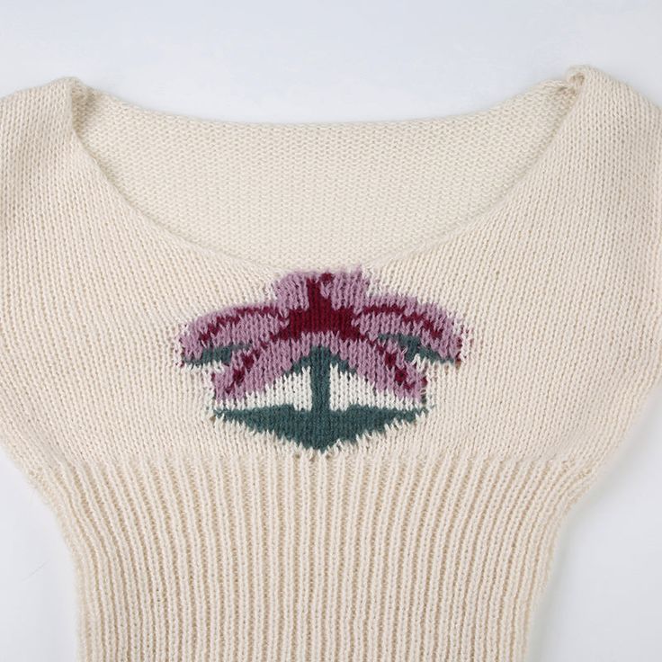 Introducing the Maiya Palm Knit Sweater, a perfect blend of cozy comfort and playful style. Crafted from soft, high-quality knit fabric, this sweater offers a snug fit that flatters your figure while keeping you warm. The standout feature is the charming palm tree design embroidered on the front, adding a touch of whimsy to your everyday look. The off-white color makes it versatile, easy to pair with your favorite jeans or skirts for a chic, laid-back ensemble. With its long sleeves and subtle s Beige Cotton Stretch Sweater, Beige Cotton Knitted Sweater, Cream Knitted Acrylic Sweater, Casual Cream Long Sleeve Knitting Pattern, Fitted Beige Crew Neck Sweater, Beige Fitted Crew Neck Sweater, Fitted Crew Neck Acrylic Top, Fitted Acrylic Crew Neck Top, Stretch Knitted Acrylic Tops