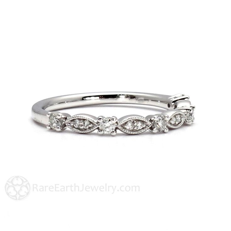 "A beautiful antique style wedding ring or anniversary ring with a pretty scalloped design, sparkling diamonds and milgrain beaded details. Gorgeous. At only 2.5mm wide, this ring works with many vintage Art Deco and Art Nouveau styles and makes a great stacking ring. Available in 14K or 18K White, Yellow or Rose Gold and Platinum. Made to order. Please allow three to four weeks for delivery. ABOUT THIS RING Band Width: 2.5mm Natural Diamonds (G-H/SI2): .20ctw Official Website: www.RareEarthJewe Diamond Eternity Band With Decorative Details For Anniversary, Anniversary Diamond Eternity Band With Decorative Details, Classic Marquise Half Eternity Wedding Ring, Fine Jewelry Wedding Rings With Milgrain Detail, Diamond Wedding Ring With Decorative Band, Diamond Wedding Band With Decorative Design, White Gold Diamond Ring With Milgrain Detail, Timeless Diamond Ring With Decorative Band For Anniversary, Timeless Anniversary Diamond Ring With Decorative Band