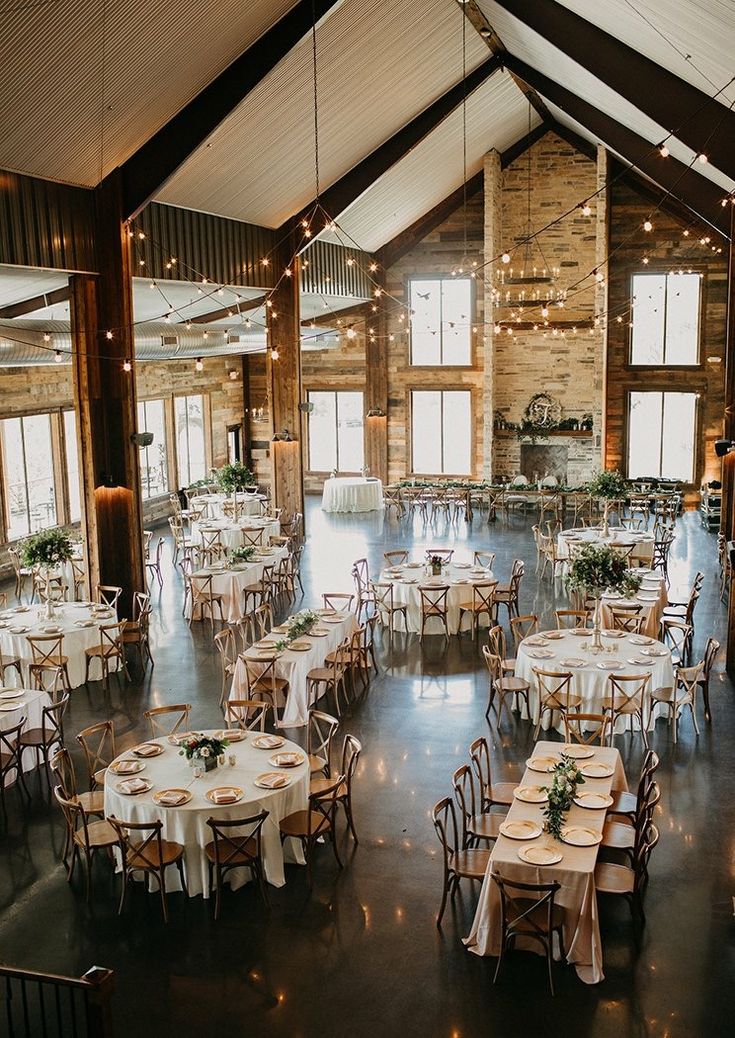 a large room with tables and chairs set up for an event