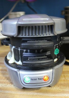 a food processor sitting on top of a wooden table