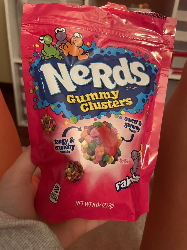 someone holding up a bag of nerds gummy clusters