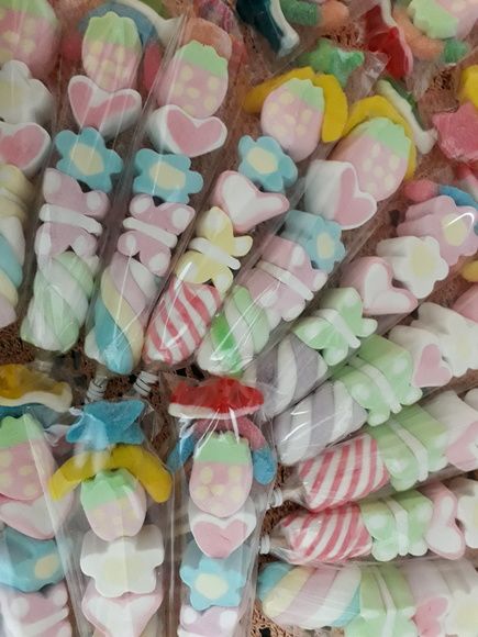 many candy candies are wrapped in cellophane to look like they have hearts on them