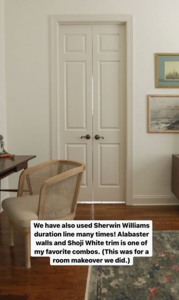 a living room with white walls and wooden floors