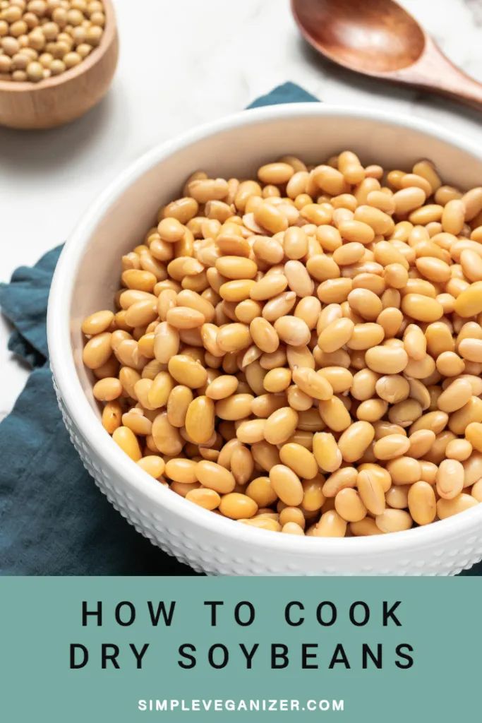 how to cook dry soy beans in a bowl with spoons on the side and text overlay