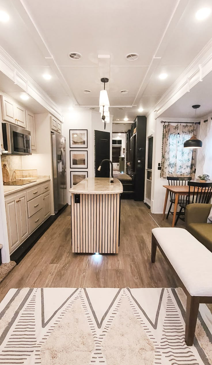 the kitchen is clean and ready to be used as a living room or dining area