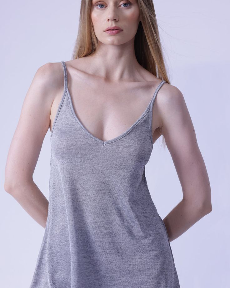 This chic cami top is a glowing essential, crafted from a luxurious blend of 95% polyester and 5% elastane that exudes sumptuous elegance. Its clean, plain pattern and classic V neckline will elevate any ensemble, while the regular fit offers the perfect form for every occasion. To ensure a lasting impression, care for this item by either hand washing or professional dry cleaning. Seamless V-neck Top For Summer, Summer Stretch V-neck Camisole, Seamless Stretch V-neck Camisole, Camisole With Built-in Bra For Loungewear, Summer V-neck Camisole For Loungewear, Elegant Summer V-neck Camisole, Modal Tops With Built-in Bra For Loungewear, Chic Tops With Built-in Bra For Layering, Chic Tops With Built-in Bra And Tank Straps