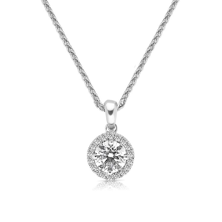 Surprise the one you adore with this classic 18K white gold Diamond Halo Pendant Necklace. The shimmering pendant showcases a classic round brilliant cut diamond artfully set to enhance size and sparkle - wrapped in a pave-lined white diamond halo. This radiant look is one she'll turn to often, everyday and on special occasions. An amazing and thoughtful anniversary gift for your loved one
0.50 carat round brilliant cut F VS1 -CGL report
0.09 carat pave
18k white gold
The Pendant desig Classic Halo Diamond Necklace In Cubic Zirconia, Classic Cubic Zirconia Diamond Necklace With Halo, Classic Cubic Zirconia Halo Diamond Necklace, Formal Diamond Solitaire Necklace With Halo Design, Cubic Zirconia Halo Diamond Necklace, Classic Cubic Zirconia Solitaire Necklace With Halo Design, Dazzling Cubic Zirconia Diamond Necklace With Halo Design, Timeless Cubic Zirconia Diamond Necklace With Halo, Dazzling Silver Solitaire Necklace With Halo Design