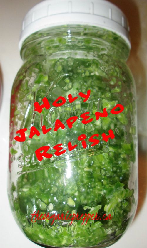 a jar filled with lots of green vegetables