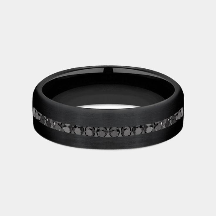 Introducing the Edison, a masterpiece of modern jewelry design that marries the sleek, enduring appeal of black titanium with the opulent brilliance of black diamonds. This 6.5mm comfort fit wedding band is a symphony of sophistication and strength, featuring a satin finish on black titanium that serves as the perfect backdrop for the twenty channel-set black diamonds. With a total carat weight of .40ct, these diamonds sparkle with a mysterious allure, making the Edison not just a ring, but a st Comfort Fit Wedding Band, Modern Jewellery Design, Black Diamonds, Channel Set, Mens Wedding Bands, Wedding Men, Modern Jewelry, Black Diamond, Satin Finish