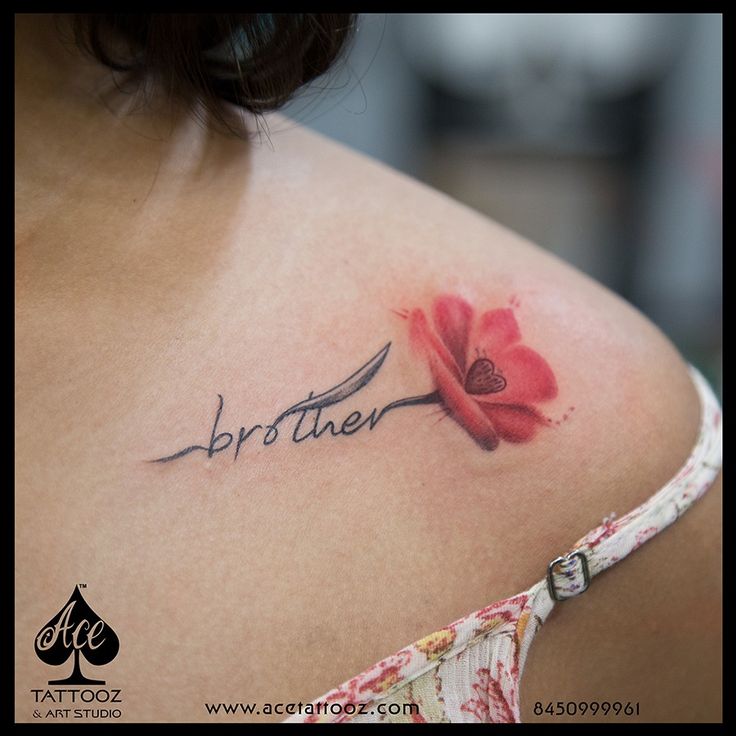 a woman with a flower tattoo on her shoulder and the word brother written in cursive ink