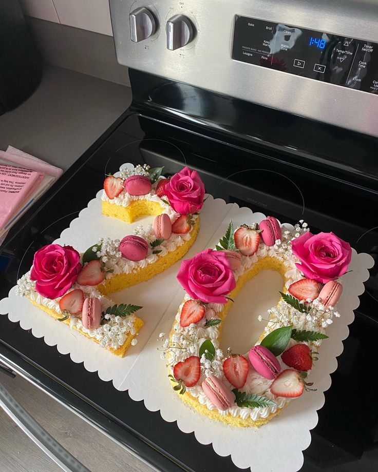 a cake shaped like the number 50 with flowers on it