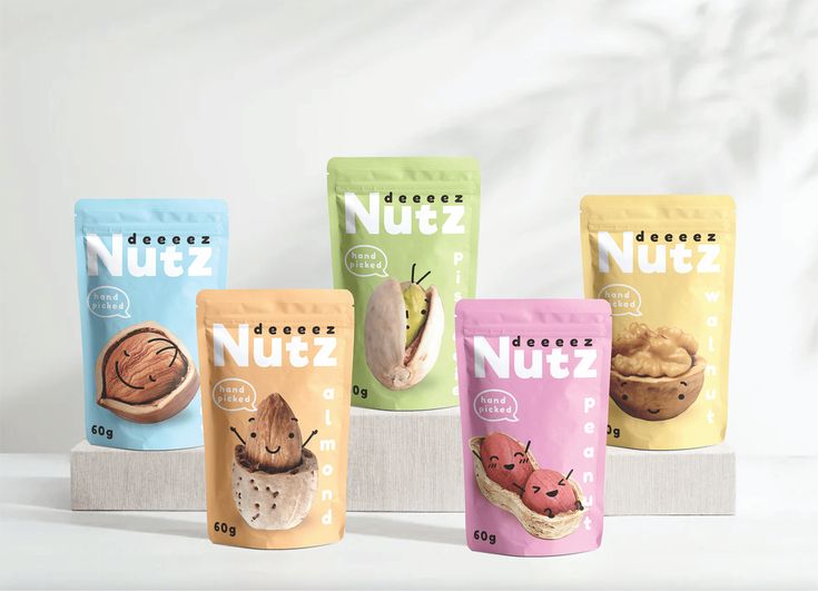 five bags of nutz are lined up on a shelf next to each other in different flavors