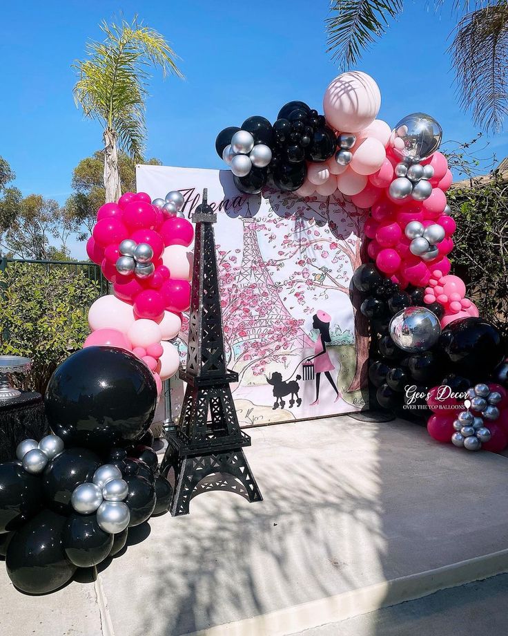 the eiffel tower is decorated with balloons