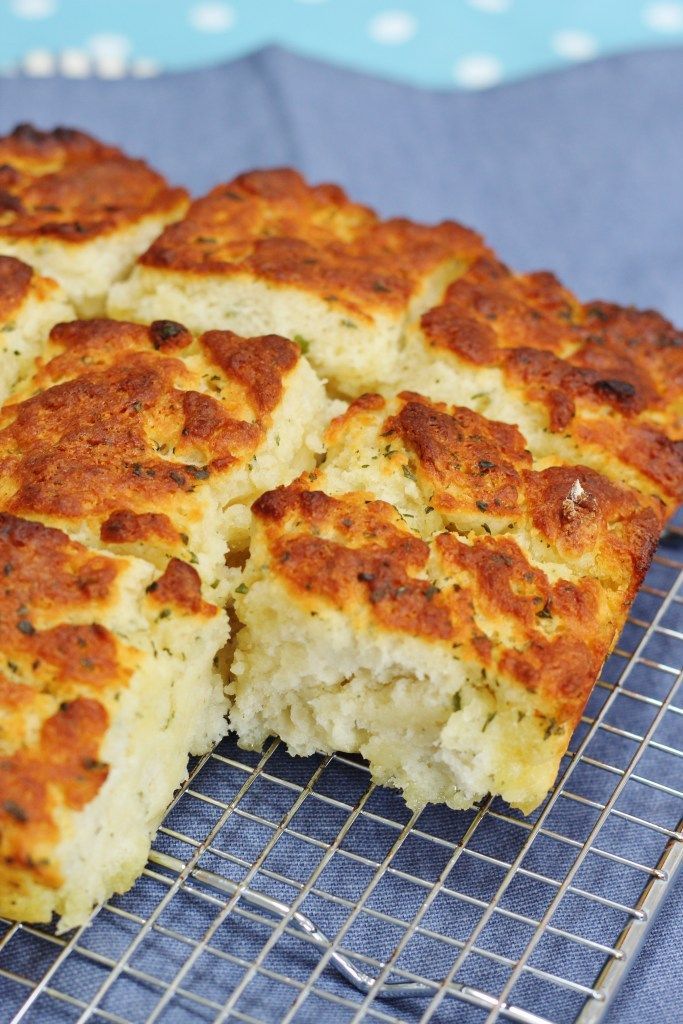 a close up of food on a cooling rack with a blue cloth in the background