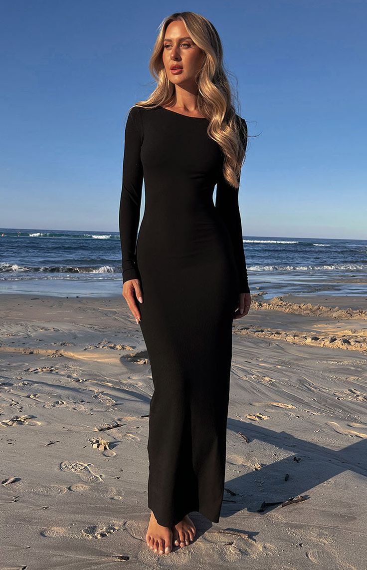 * Black Long Sleeve Maxi Dress 
 * 
 
 * HOW TO STYLE 
 * A sexy staple for your winter wardrobe ()! This long sleeve maxi dress () stuns with its open back design, perfect for rooftop cocktails in the colder months! This multi-wear piece can be worn in reverse with the matching () black crop top. 
 * 
 
 * FEATURES 
 * Open back design 
 * Black crop top with adjustable straps included 
 * Tie up detail at nape of neck 
 * Long sleeves 
 * Light weight ribbed material 
 * Lots of stretch 
 * Un Black Long Sleeve Maxi Dress, Long Sleeve Black Maxi Dress, Concert Dresses, Mermaid Sweetheart, Prom Midi Dress, Black Dress With Sleeves, Dresses Mermaid, Black Crop Top, Beginning Boutique