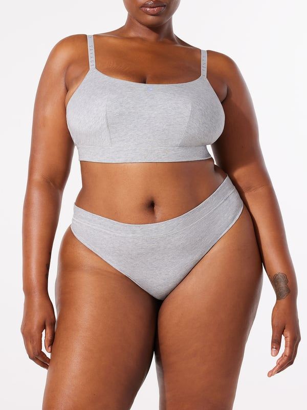 A lightweight, breathable must-have, our Cotton Essentials Thong Panty is made from a super-soft cotton jersey fabric and features a mid-rise waist. Cotton Bottoms With Moderate Coverage For Everyday, Sporty Seamless Bottoms For Everyday, Sporty Seamless Everyday Bottoms, Sporty Cotton Bottoms With Soft Touch, Gray Seamless Cotton Bottoms, Cotton Bottoms With Seamless Construction For Loungewear, Cotton Seamless Loungewear Bottoms, Seamless Minimal Stretch Bottoms For Loungewear, Seamless Cotton Bottoms