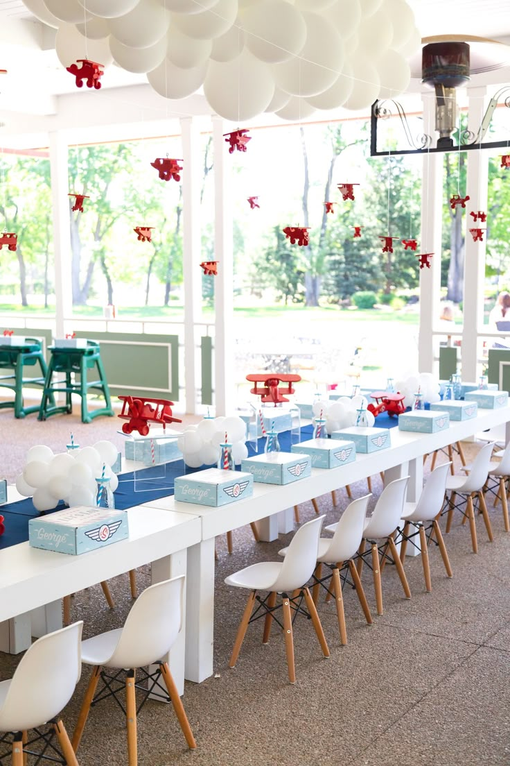 a long table is set up with blue and white boxes