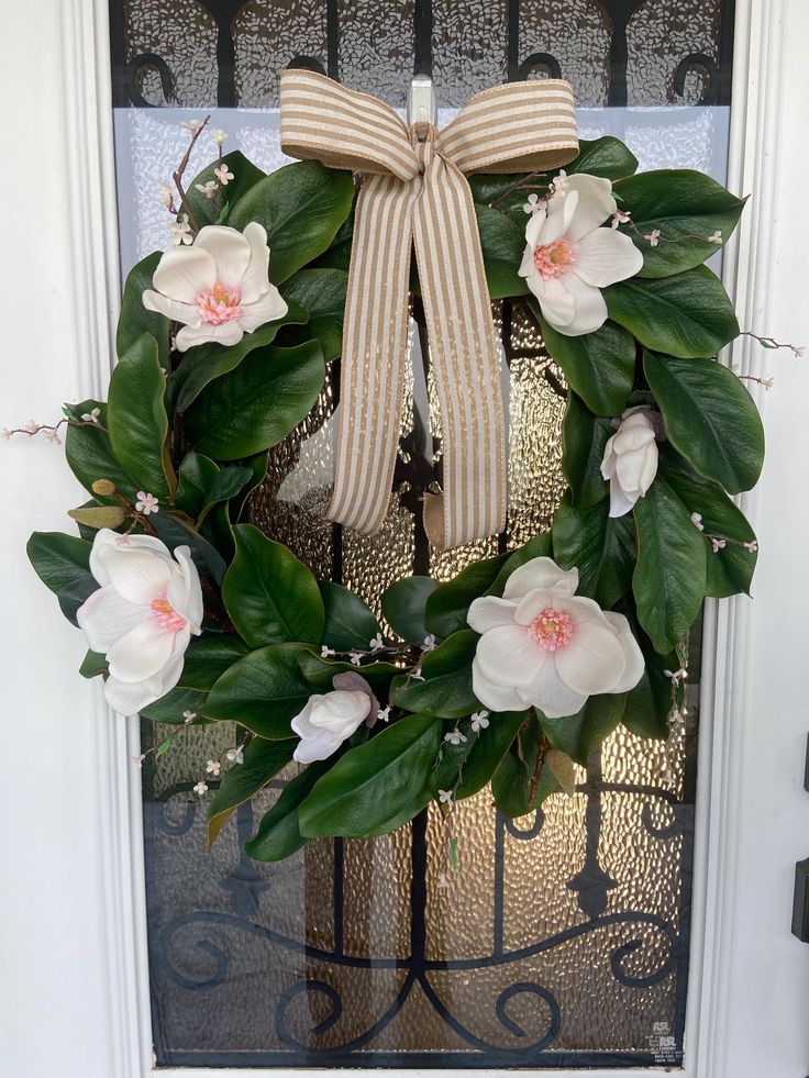 Beautiful blush magnolia blooms and buds, cherry blossom accent flowers, lush, green nearly natural leaves on a grapevine base. Striped bow is made with high quality wired ribbon. Elegant everyday wreath. Accent Flowers, Magnolia Wreath, Nearly Natural, Leaf Nature, Everyday Wreath, Wired Ribbon, Door Wreath Hanger, Lush Green, Door Hangers