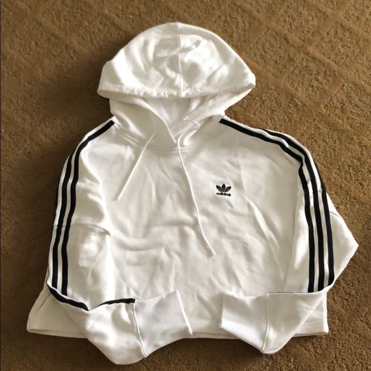 Cropped Hoodie 3 Striped Along Both Sleeves Great Condition Never Worn Casual Cotton Sweatshirt With Three Stripes, White Hooded Sweatshirt For Spring, White Hooded Spring Sweatshirt, Spring White Hooded Sweatshirt, Trendy White Hoodie With Ribbed Cuffs, Adidas Three Stripes Fall Sweatshirt, Adidas Sportswear Hoodie With Three Stripes, Trendy White Sweatshirt With Double-lined Hood, White Hoodie With Double-lined Hood For Spring