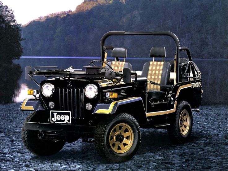 a jeep with two seats is parked on the rocks