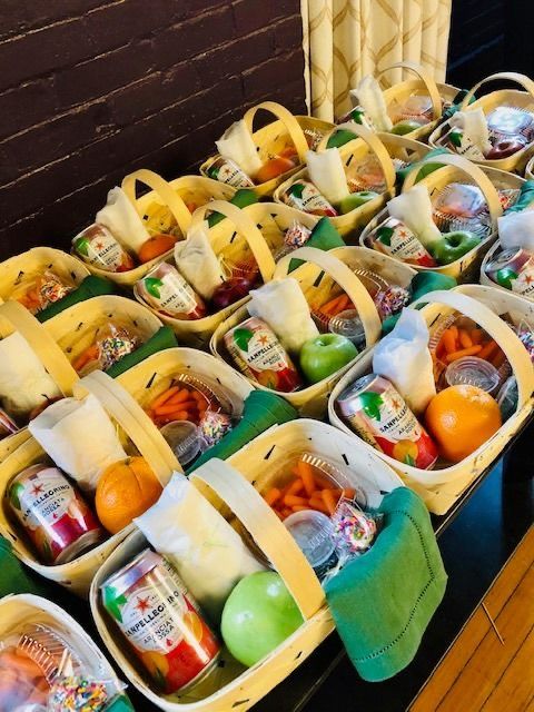 several baskets filled with fruits and vegetables on a table