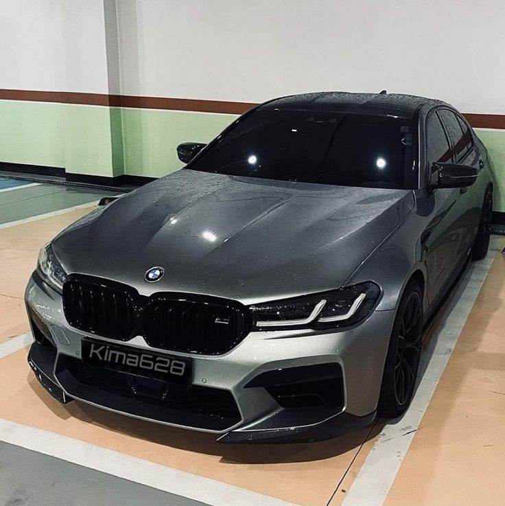 a silver car is parked in a garage