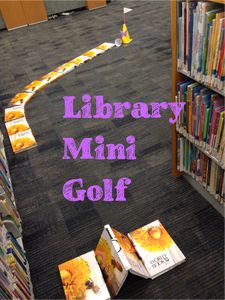 the library mini golf course is set up in front of bookshelves with sunflowers on them