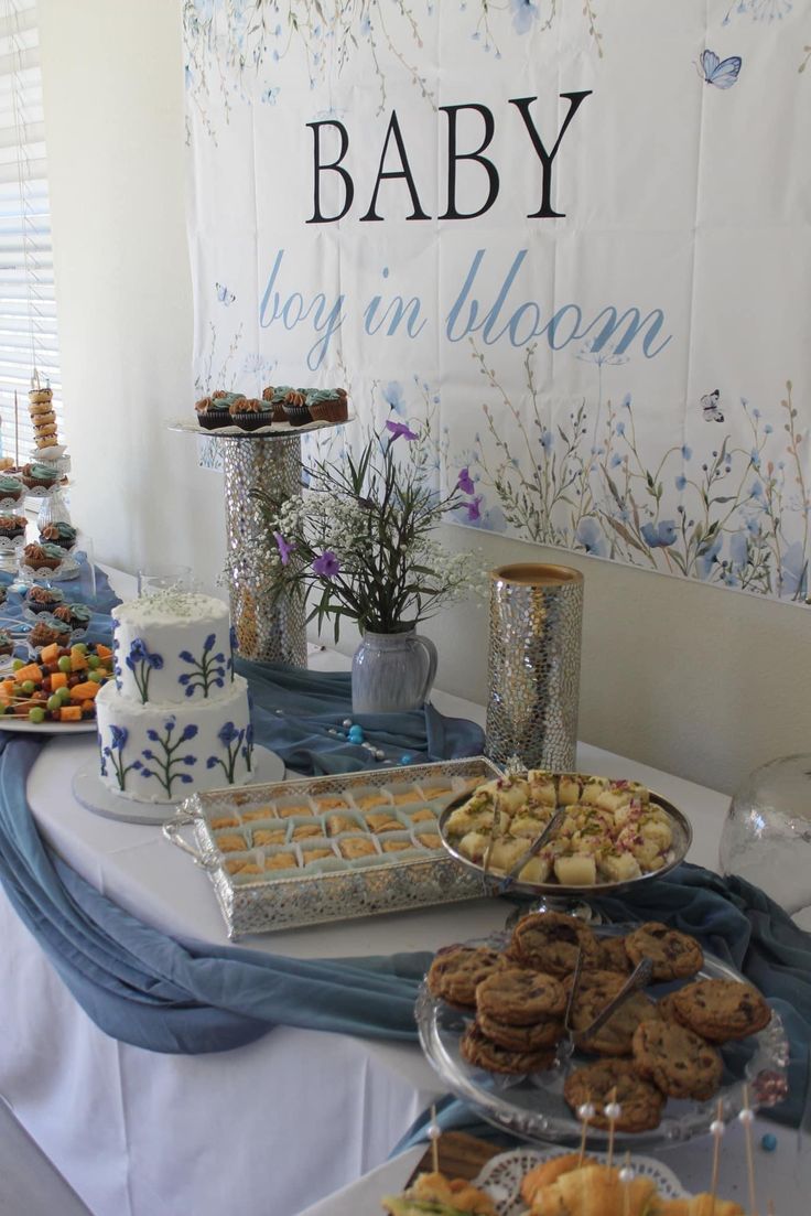 a baby shower party with cookies and desserts