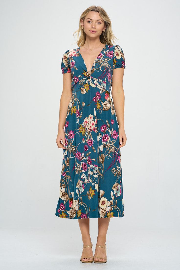 This is our versatile Printed Midi dress that is perfect blend of style and comfort for any occasion. It features a cute ribbon keyhole and comfortable short sleeve. The perfect midi length makes it versatile choice for your wardrobe. Material: 96% Polyester 4% Spandex Machine washable Floral Print Short Sleeve Midi Dress For Brunch, Casual V-neck Short Sleeve Dress With Floral Print, Modest Short Sleeve Maxi Dress For Garden Party, Casual Midi Dress With Floral Print And Short Sleeves, Short Sleeve Rayon Midi Dress For Garden Party, Casual Short Sleeve Rayon Midi Dress, Modest Short Sleeve Midi Dress For Spring, Modest Short Sleeve Midi Dress For Beach, Modest Short Sleeve Summer Dress