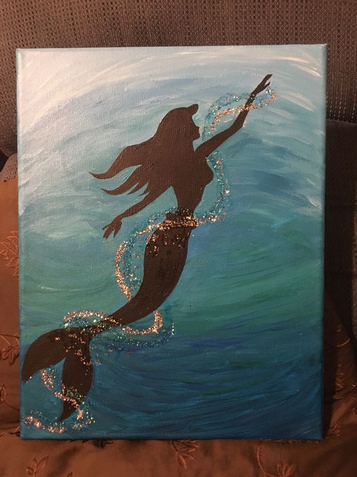 a painting of a mermaid swimming in the ocean