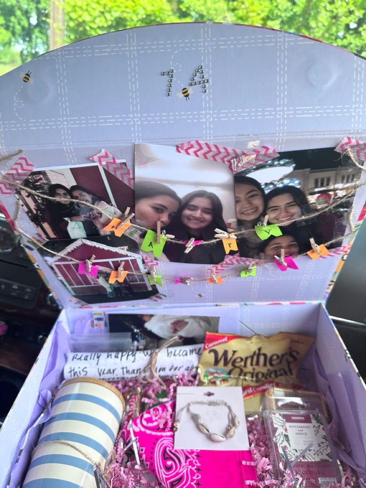 an open box filled with pictures and other things to put in the back of it