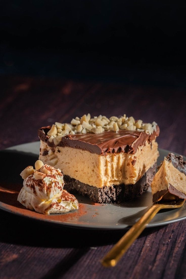 a piece of cheesecake on a plate with two pieces cut out next to it