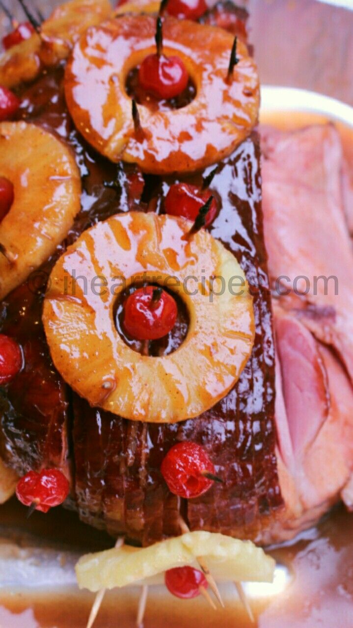 pineapple upside down cake with cherries on the top and sliced bananas in the middle