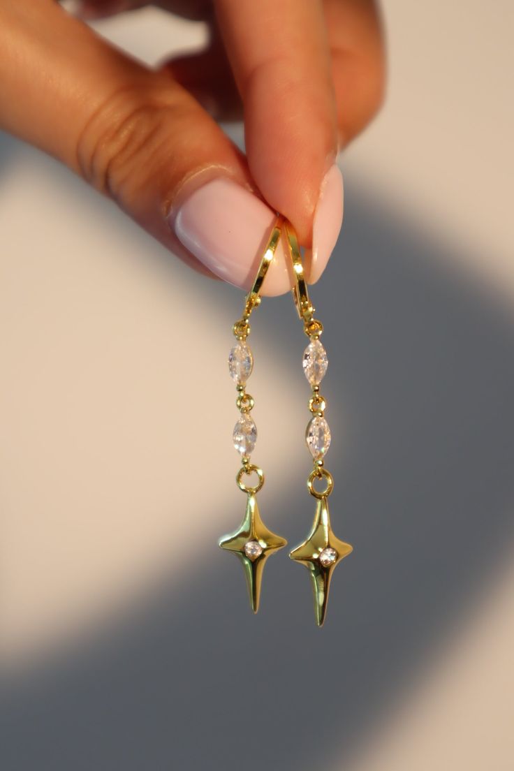 24K Gold Star Dangle Earrings – Cutethingscommin Gold Plated Drop Earrings, Ethereal Earrings Aesthetic, Dangling Star Earrings, Dangly Earrings Gold, Short Dangle Earrings, Cubic Zirconia Drop Earrings With Star Charm, Gold Celestial Cubic Zirconia Earrings, Celestial Gold Cubic Zirconia Earrings, Gold Earrings Aesthetic