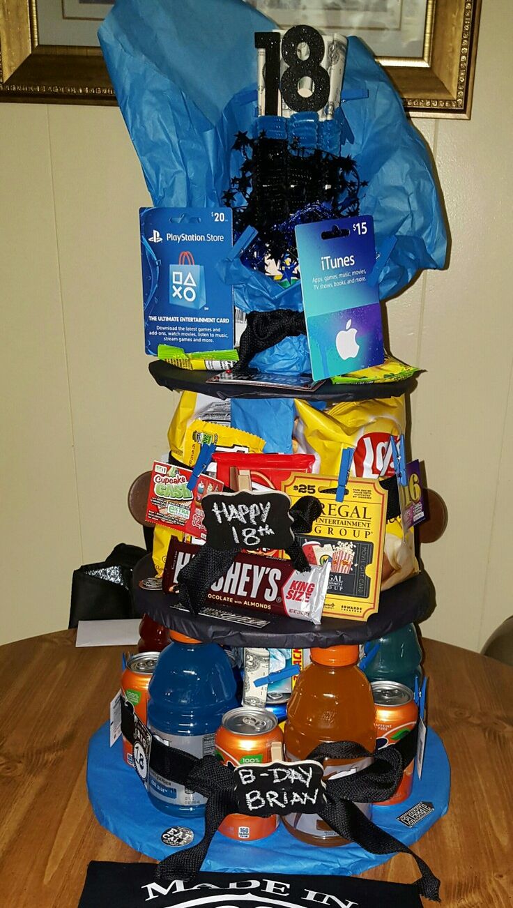 a pile of items sitting on top of a wooden table next to a framed photo