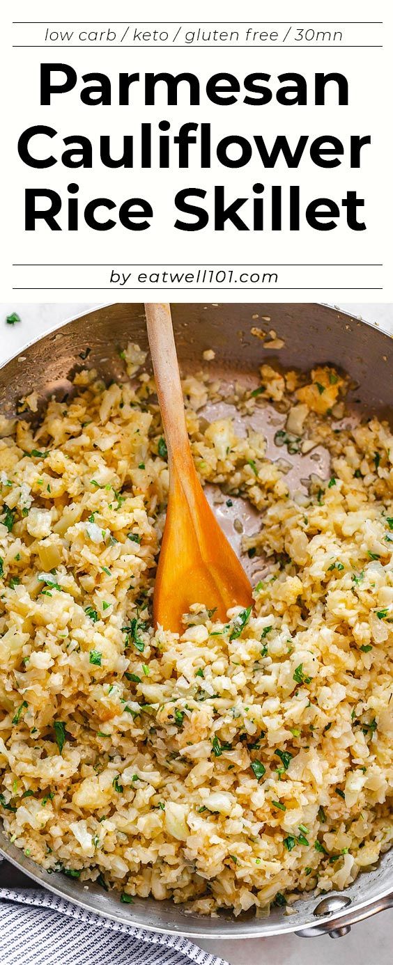 parmesan cauliflower rice skillet in a pan with a wooden spoon