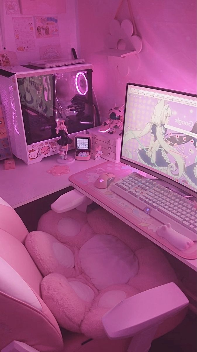 a laptop computer sitting on top of a pink desk