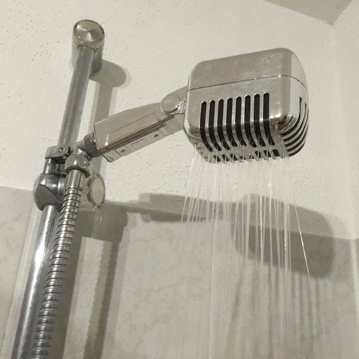 a shower head with water coming out of it