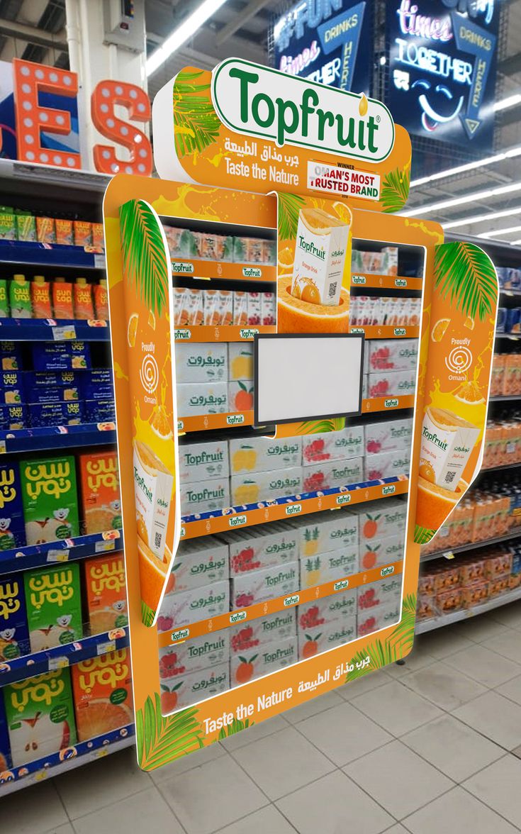 a topfrut display in a grocery store filled with oranges and other drinks