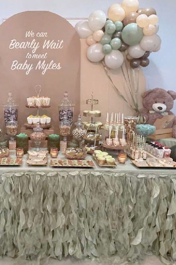 a baby shower party with teddy bears and desserts