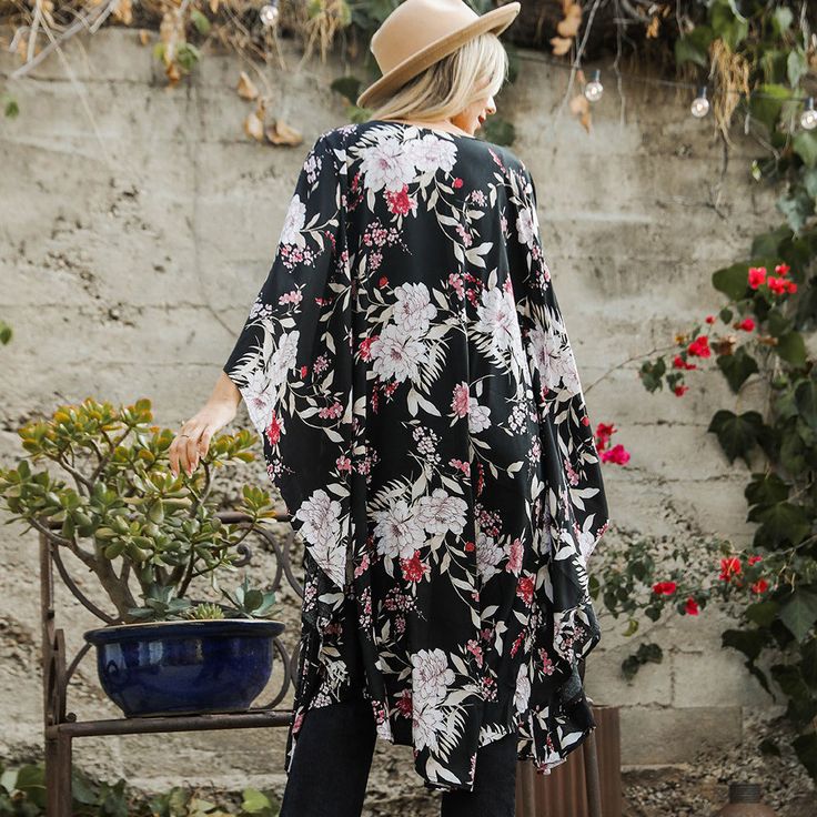 Flutter into fashion with our Floral Butterfly Sleeve Kimono! Featuring a beautiful butterfly print and flowy sleeves, this kimono is the perfect addition to any outfit. Soar with style and embrace your inner free spirit. Flowy V-neck Kimono For Day Out, Casual Black V-neck Kimono, Flowy Long Sleeve Kimono For Day Out, Flowy Fall Kimono For Vacation, Flowy Kimono For Fall Vacation, Flowy Kimono For Spring Loungewear, Spring Summer Kimono For Brunch, Flowy Casual Kimono For Day Out, Summer Style Spring Kimono For Brunch