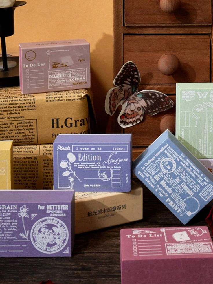 several soaps are stacked on top of each other in front of an old dresser