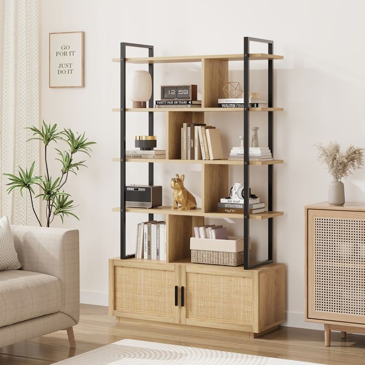 a living room filled with furniture and a book shelf on top of a hard wood floor