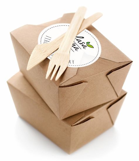 wooden utensils sitting on top of brown boxes with white labels and stickers