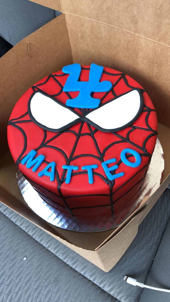 a spiderman birthday cake in a box