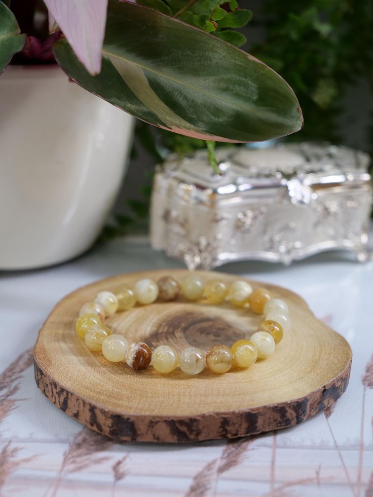 Yellow Opal Elastic Bracelet Elastic Bracelet Specifications: - Handmade by Ethereal Gems Jewellery - Natural 8mm Yellow Opal Gemstone - Comes with a gift box  - Bracelet Size: 6inch (15.2cm), 6.5inch (16.5cm), 7inch (17.8cm),                              7.5inch (19cm), 8inch (20.3cm), 8.5inch (21.59cm) ADDITIONAL INFORMATION ABOUT YELLOW OPAL: CHAKRA: SOLAR PLEXUS ELEMENT: EARTH & WATER ZODIAC: LEO, CANCER, SCORPIO, SAGITTARIUS, PISCES & LIBRA MEASURING YOUR WRIST FOR AN ACCURATE BRACELET SIZE Element Earth, Zodiac Leo, Sagittarius Pisces, Yellow Opal, Gemstone Meanings, Crystal Energy, Jewelry Men, Scorpio Sagittarius, Solar Plexus